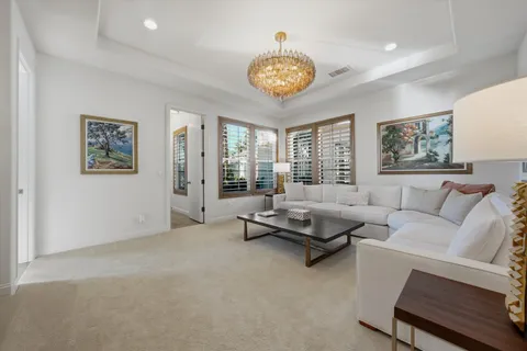 a spacious bathroom with a sink double vanity granite tub shower and a mirror