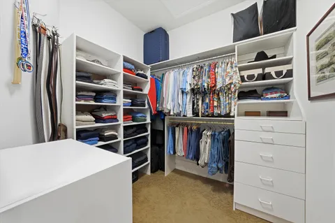 a view of a dining room with furniture and a floor to ceiling window
