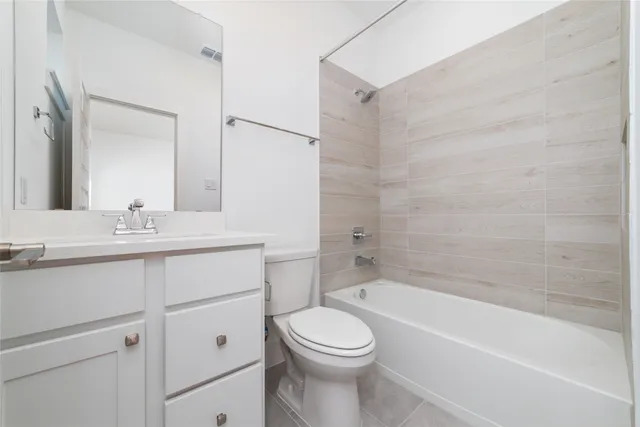 a bathroom with a sink a toilet and a bathtub