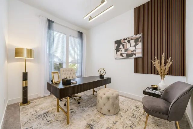 a work room with furniture and wooden floor