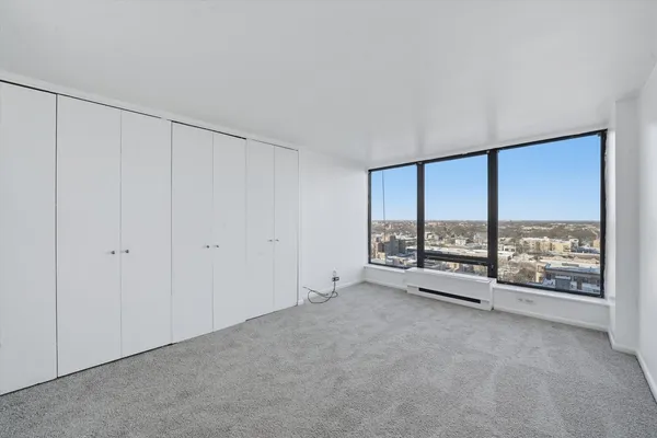 a view of an empty room with a sliding door