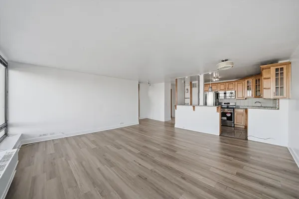 a view of kitchen with wooden floor