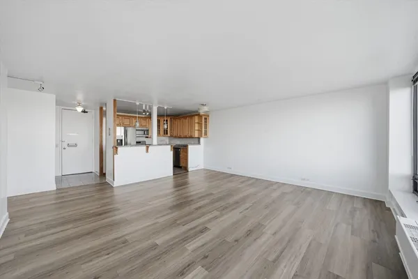 a view of a kitchen with wooden floor