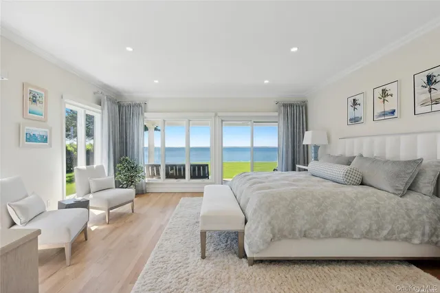 a spacious bedroom with a large bed and a couch