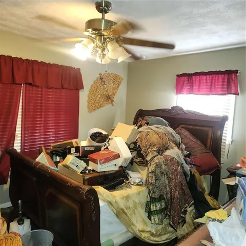 a bedroom with furniture and a chandelier