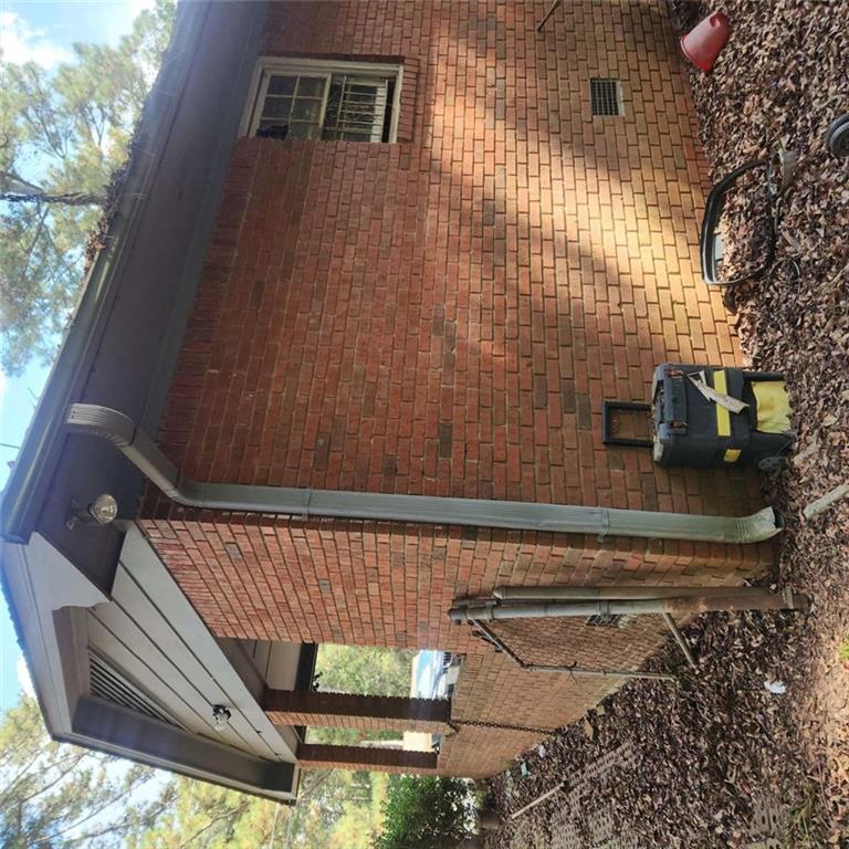 4461 Yates Road College Park, GA 30337 - Photo 17 of 19 a brick house with a yard