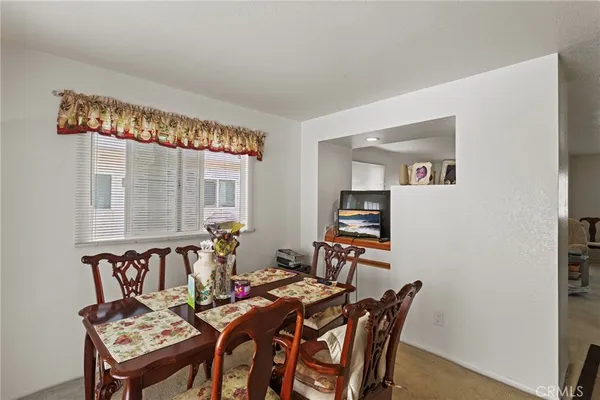 a view of a dining room with furniture