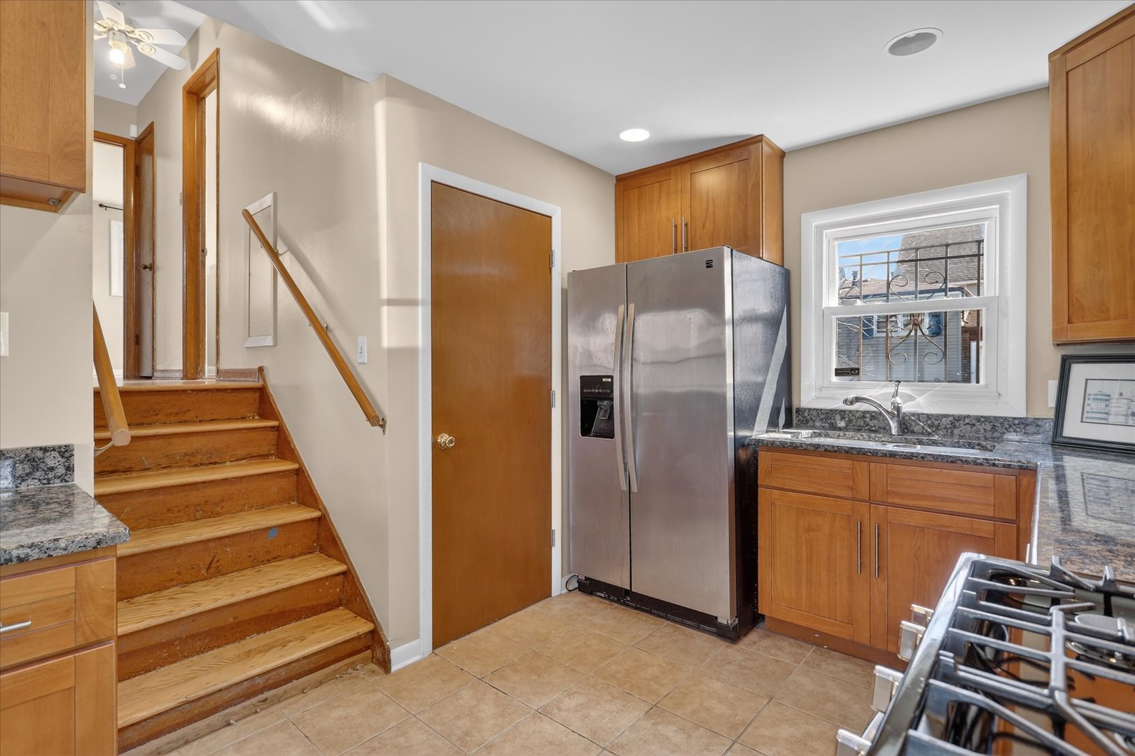 14911 Page Avenue Harvey, IL 60426 - Photo 16 of 35 a view of a kitchen with wooden floor and electronic appliances