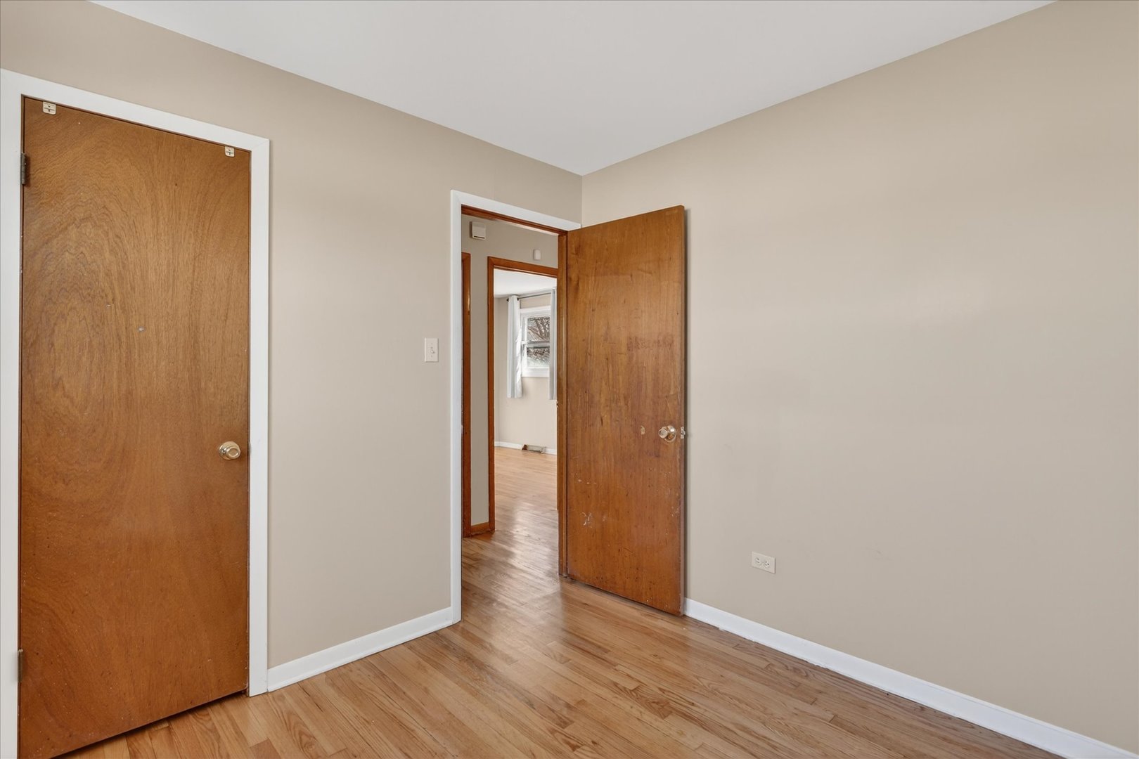 14911 Page Avenue Harvey, IL 60426 - Photo 24 of 35 a view of an empty room with wooden floor