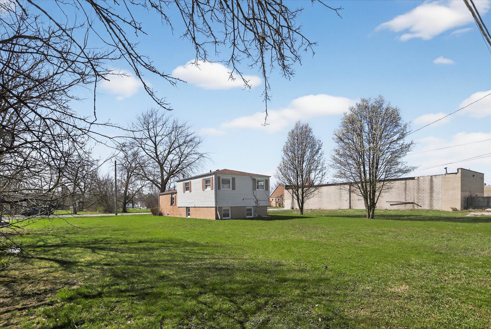 14911 Page Avenue Harvey, IL 60426 - Photo 32 of 35 a view of a house with a big yard