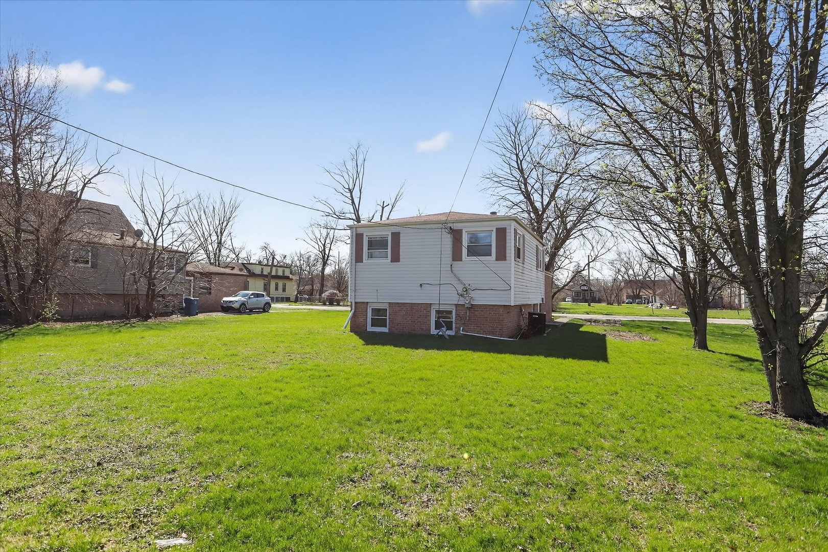 14911 Page Avenue Harvey, IL 60426 - Photo 33 of 35 a view of a house with a yard