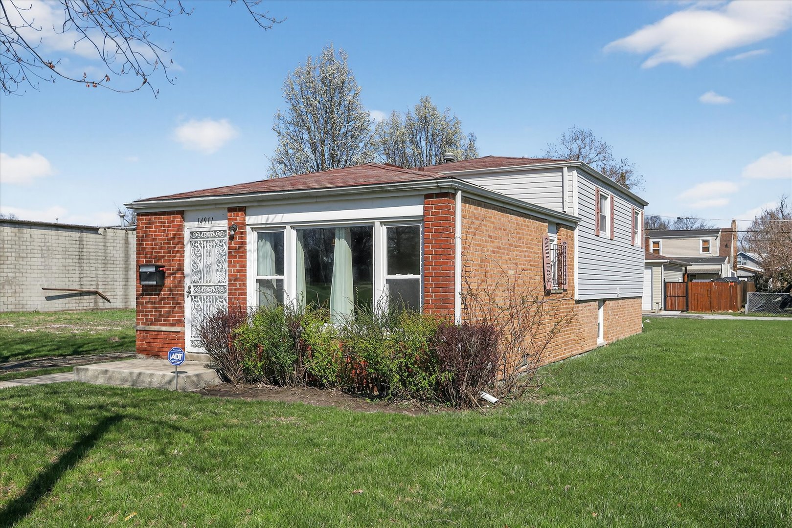 14911 Page Avenue Harvey, IL 60426 - Photo 4 of 35 a view of a house with backyard and garden