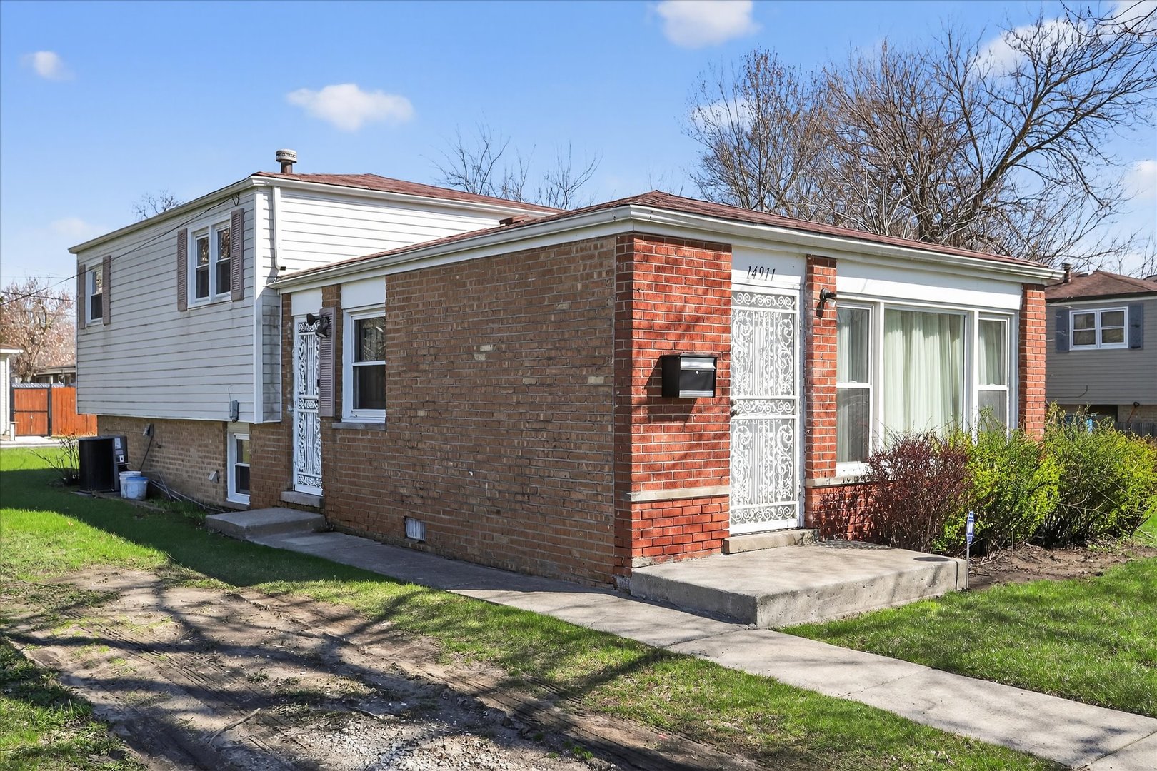 14911 Page Avenue Harvey, IL 60426 - Photo 5 of 35 a view of a house with backyard and garden