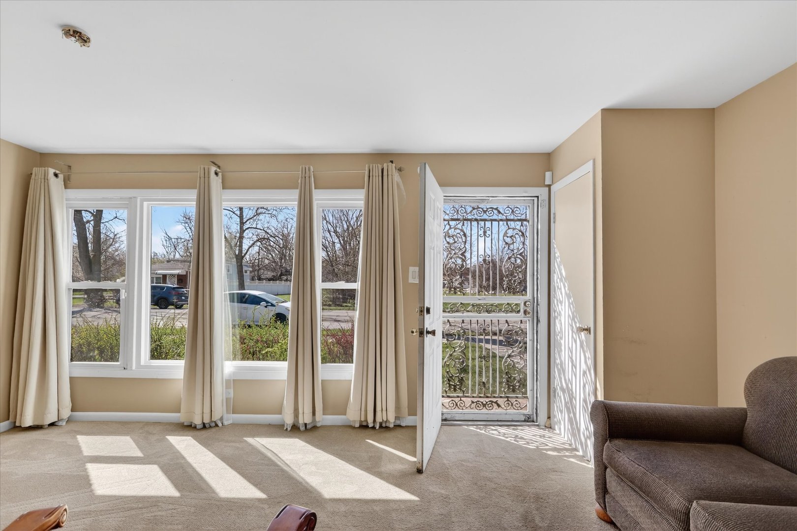 14911 Page Avenue Harvey, IL 60426 - Photo 7 of 35 a living room with furniture and large windows