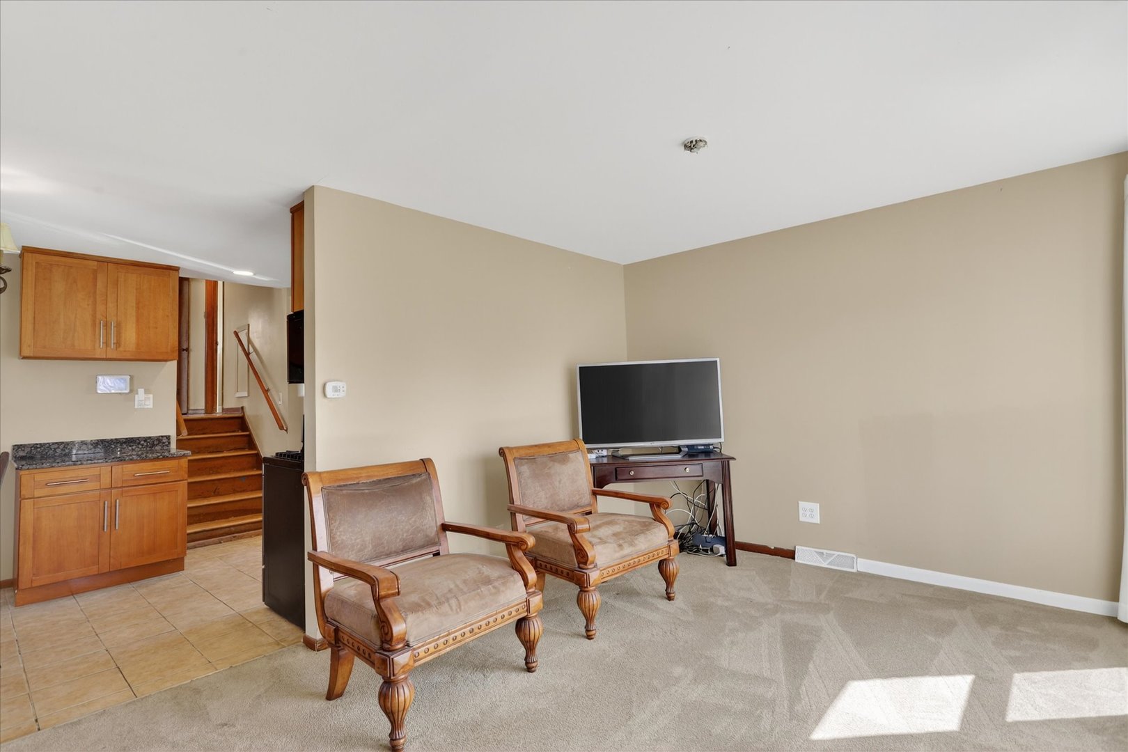14911 Page Avenue Harvey, IL 60426 - Photo 9 of 35 a view of a livingroom with furniture and a flat screen tv