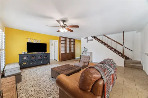 a living room with furniture and a flat screen tv