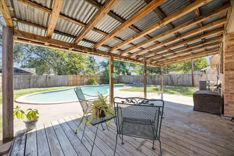 a view of a swimming pool with a patio