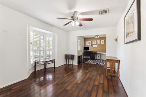 a view of a livingroom with furniture and hardwood floor