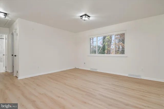 a kitchen with a sink stainless steel appliances and cabinets