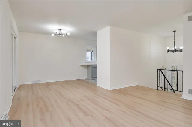 a kitchen with stainless steel appliances a refrigerator and cabinets