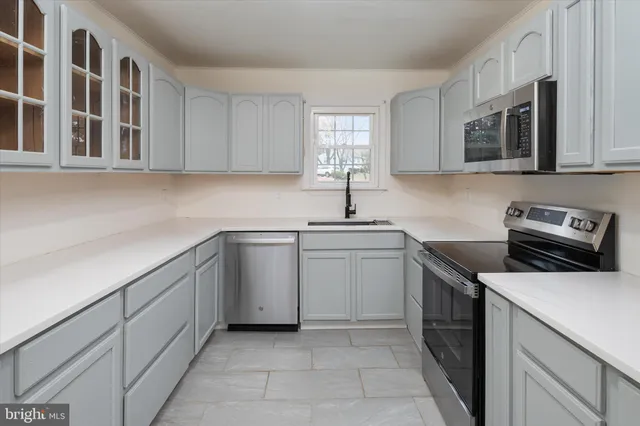 a view of a two room with wooden floor and wooden deck