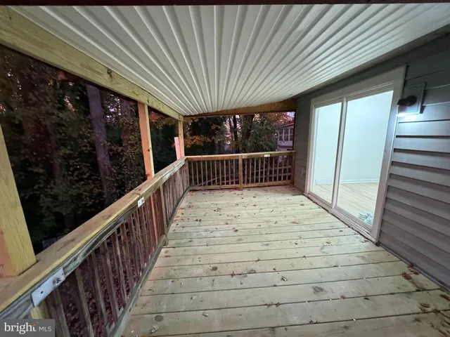 a view of balcony with wooden floor
