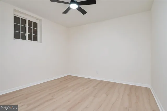 a view of a room with stairs and wooden fence