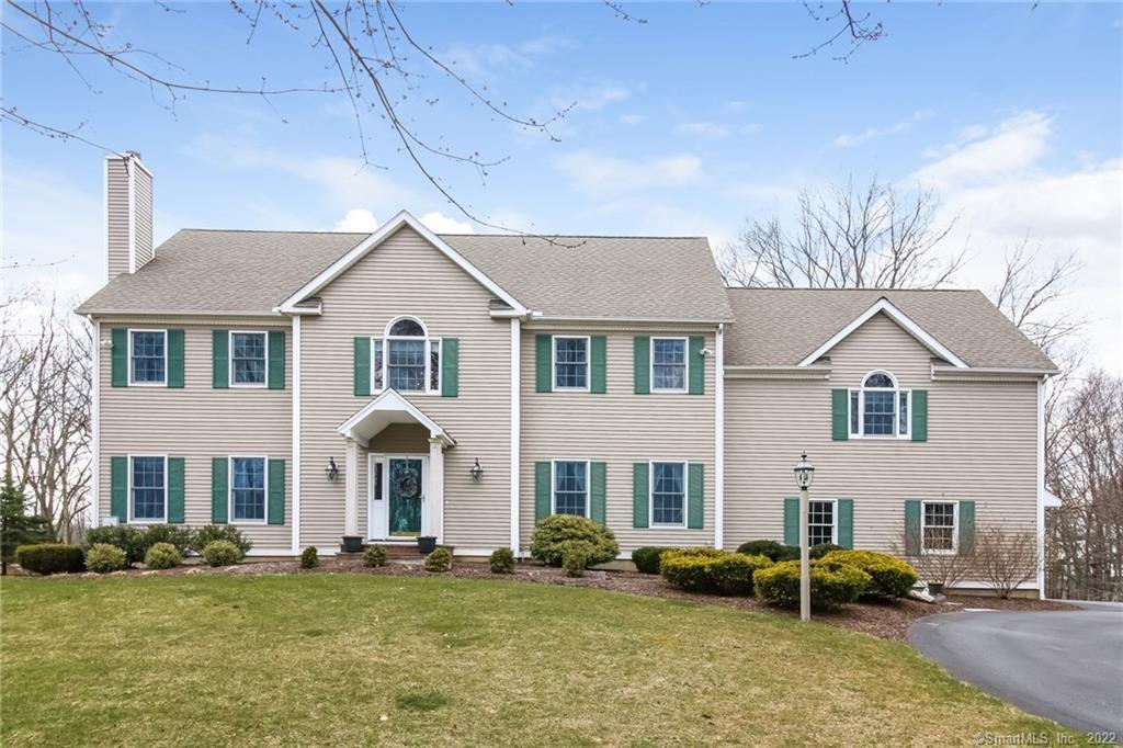 58 Pine Tree Hill Road Newtown, CT 06470 - Photo 1 of 1 a front view of a house with a yard
