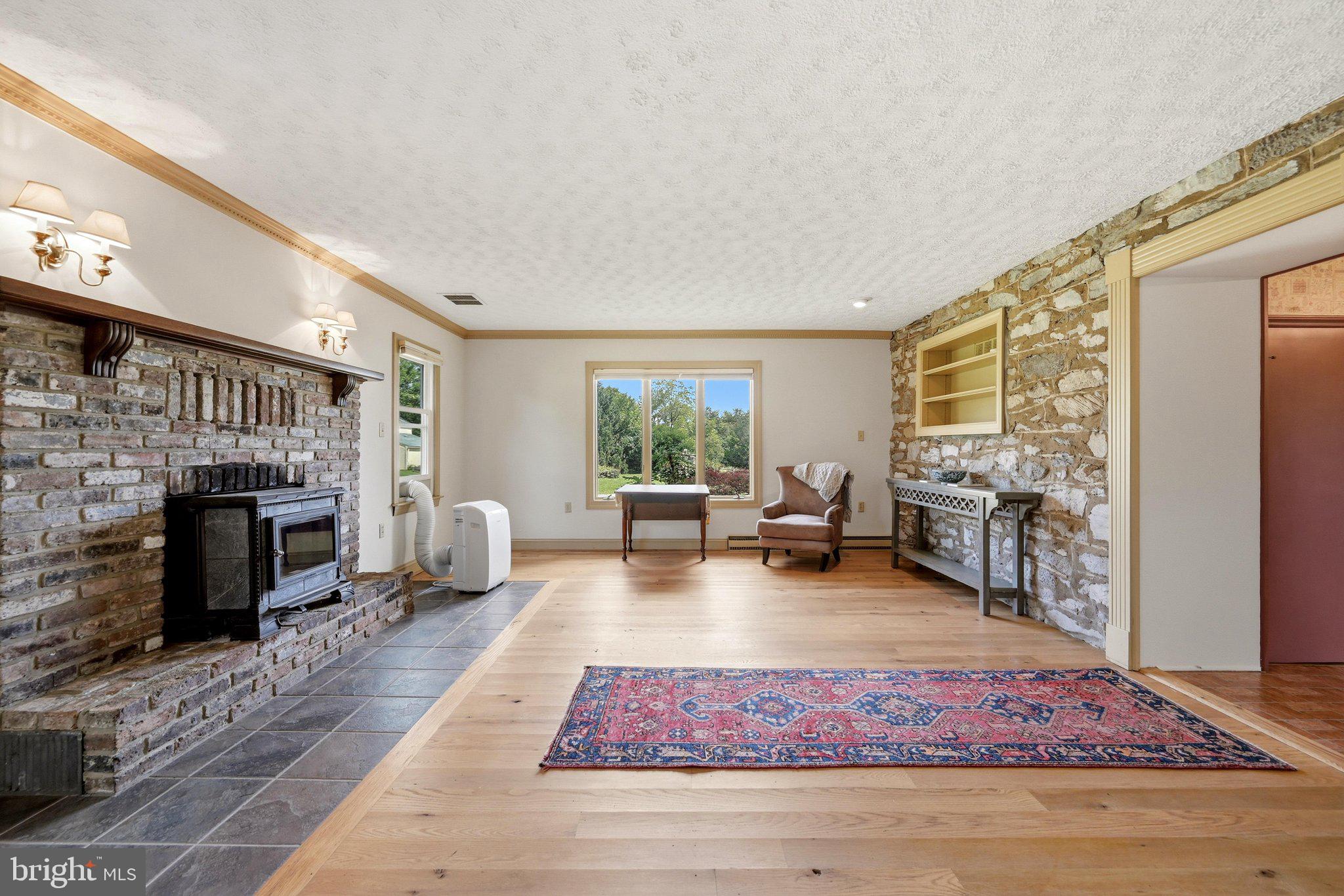 936 Gun Barrel Road White Post, VA 22663 - Photo 36 of 106 The Living Room Has an Exposed Stone Wall