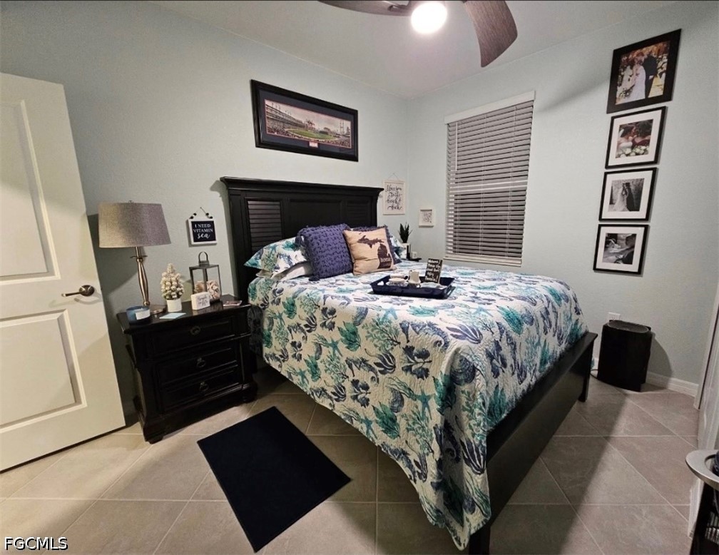 14191 Poppy Fld Loop, Unit 5312 Punta Gorda, FL 33955 - Photo 31 of 41 a bedroom with a bed and a lamp on dresser