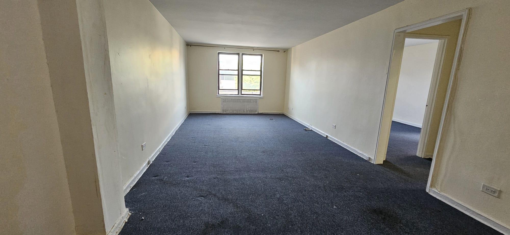 65-35 108th Street, Unit B7 Queens, NY 11375 - Photo 2 of 6 an empty room with windows
