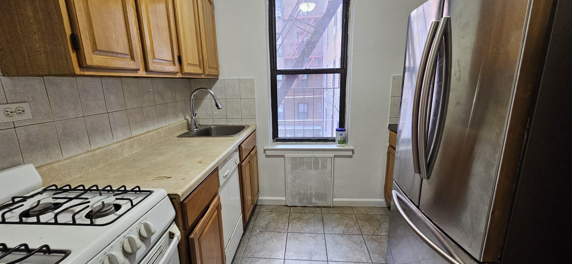 65-35 108th Street, Unit B7 Queens, NY 11375 - Photo 3 of 6 a kitchen with a sink and a stove