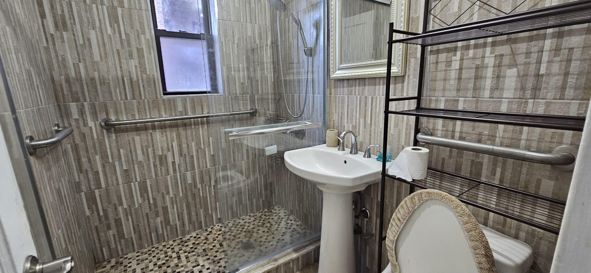 65-35 108th Street, Unit B7 Queens, NY 11375 - Photo 4 of 6 a bathroom with a sink toilet and shower
