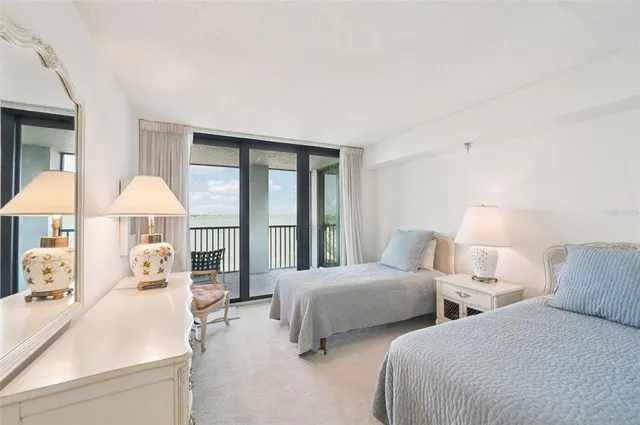 a view of a building with a yard and sitting area