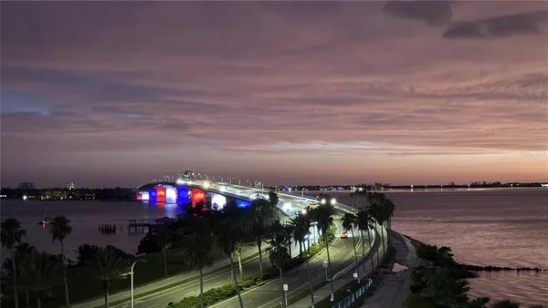 a view of balcony with wooden floor