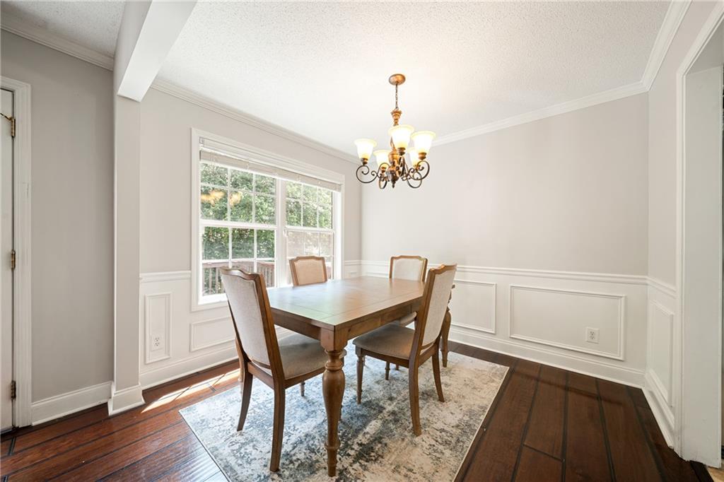 921 Pace Road Hiram, GA 30141 - Photo 9 of 41 a view of a dining room with furniture window and wooden floor
