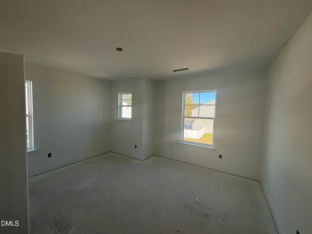 a view of empty room with windows