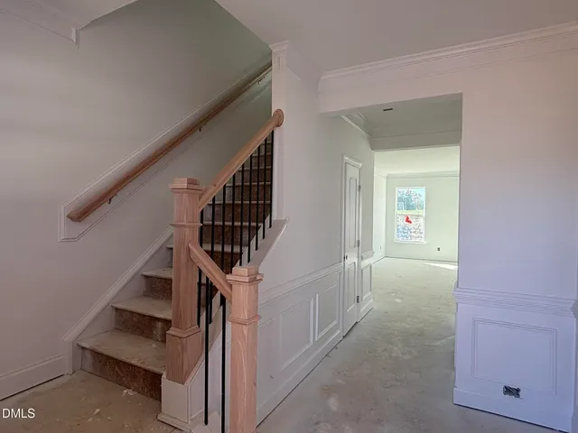 a view of entryway and hall with wooden floor