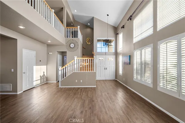 a view of an entryway with wooden floor