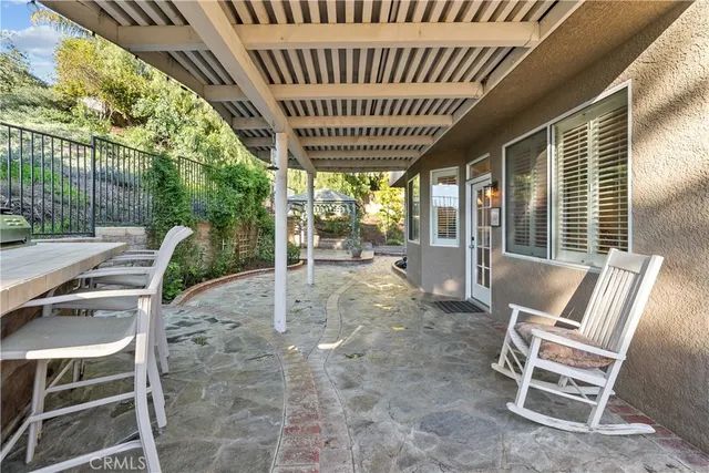 a view of a chairs and table in the patio