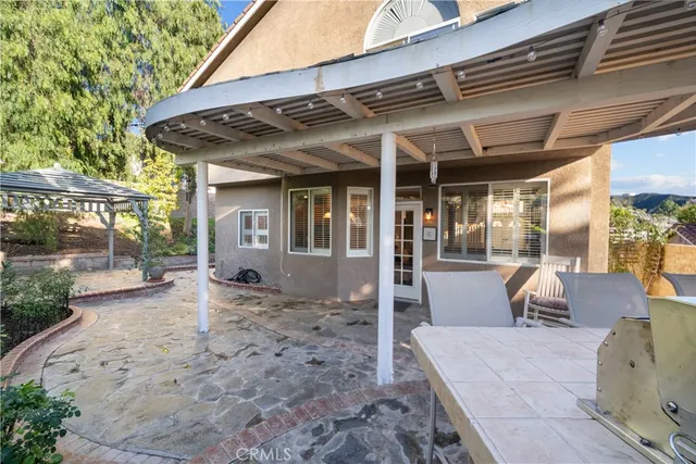 a view of a chairs and table on the deck