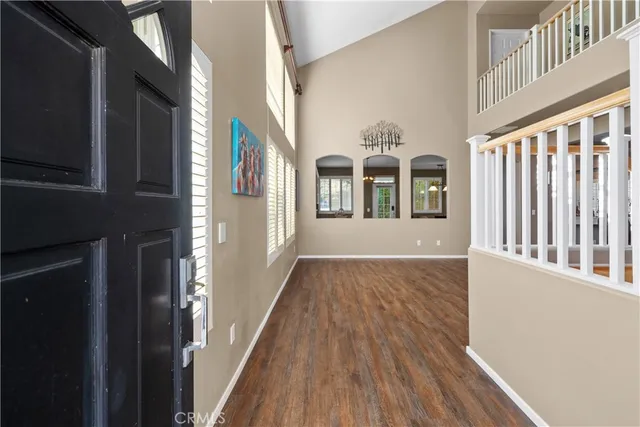 a view of a porch with wooden floor and furniture