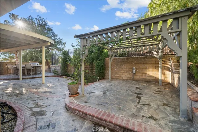 a view of a livingroom with workspace and a ceiling fan