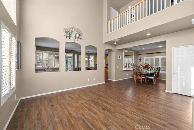 a view of dining room with furniture and wooden floor