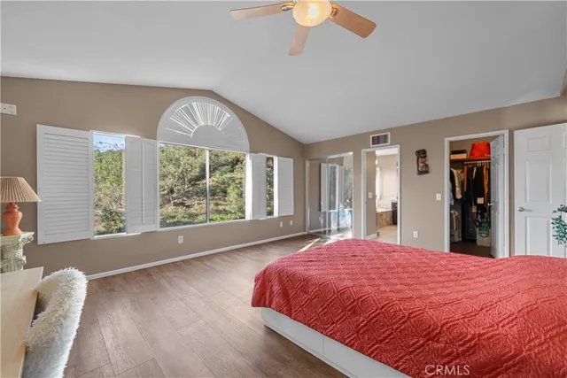 a spacious bathroom with a granite countertop tub a sink and a shower