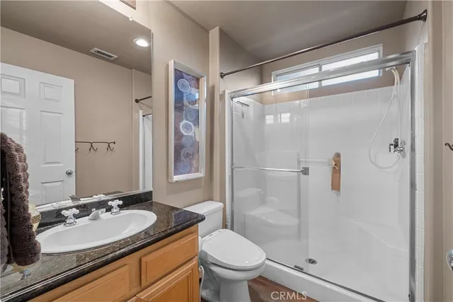 a picture of a bench in front of a wall