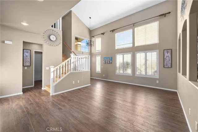 a view of an entryway with wooden floor