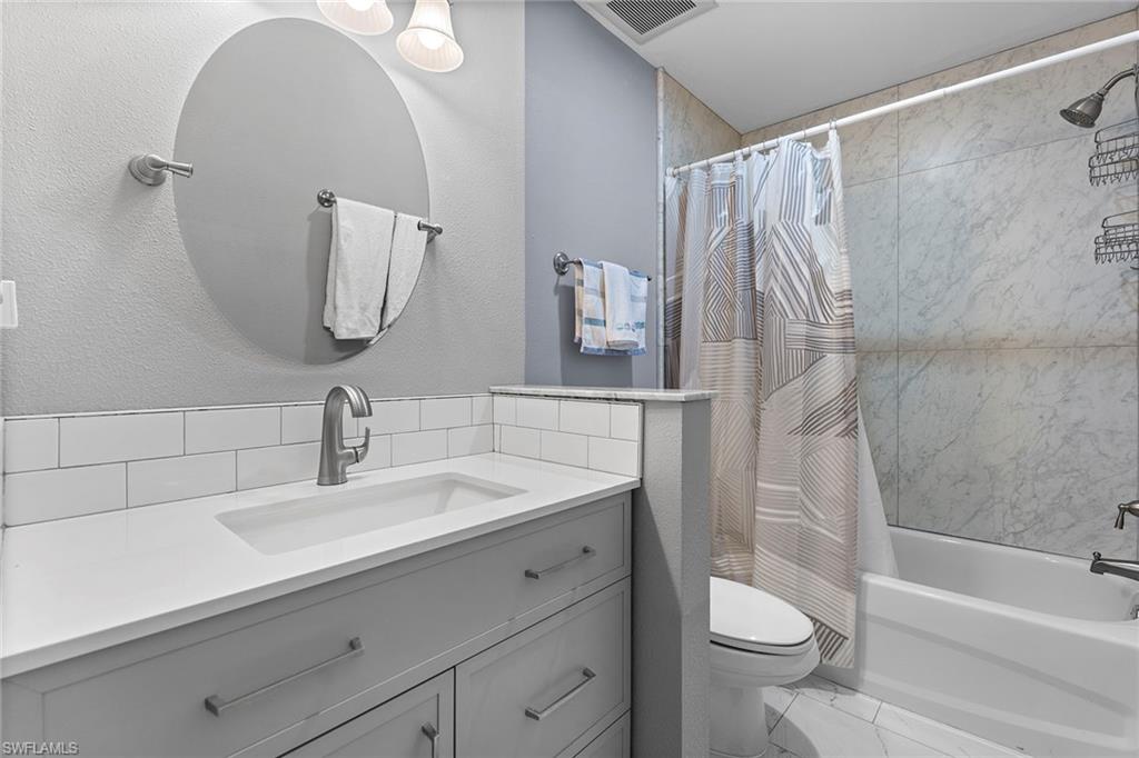 14929 Wise Way, Unit 931 Fort Myers, FL 33905 - Photo 13 of 39 a bathroom with a sink a toilet and a bathtub