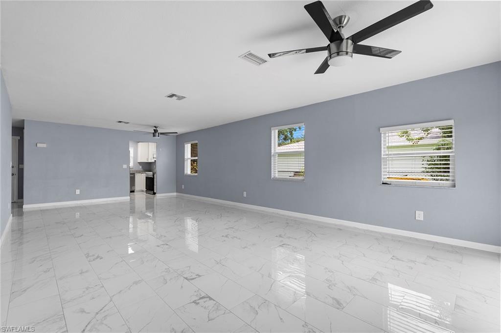 14929 Wise Way, Unit 931 Fort Myers, FL 33905 - Photo 20 of 39 a view of a livingroom with a ceiling fan and window