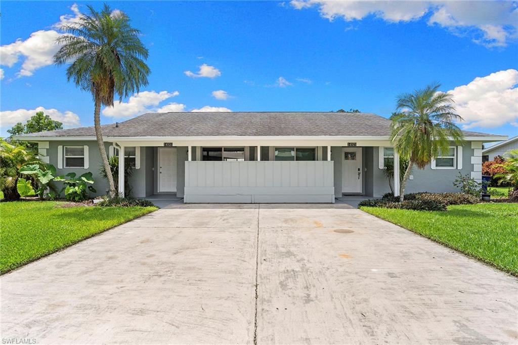 14929 Wise Way, Unit 931 Fort Myers, FL 33905 - Photo 2 of 39 a front view of a house with a garden